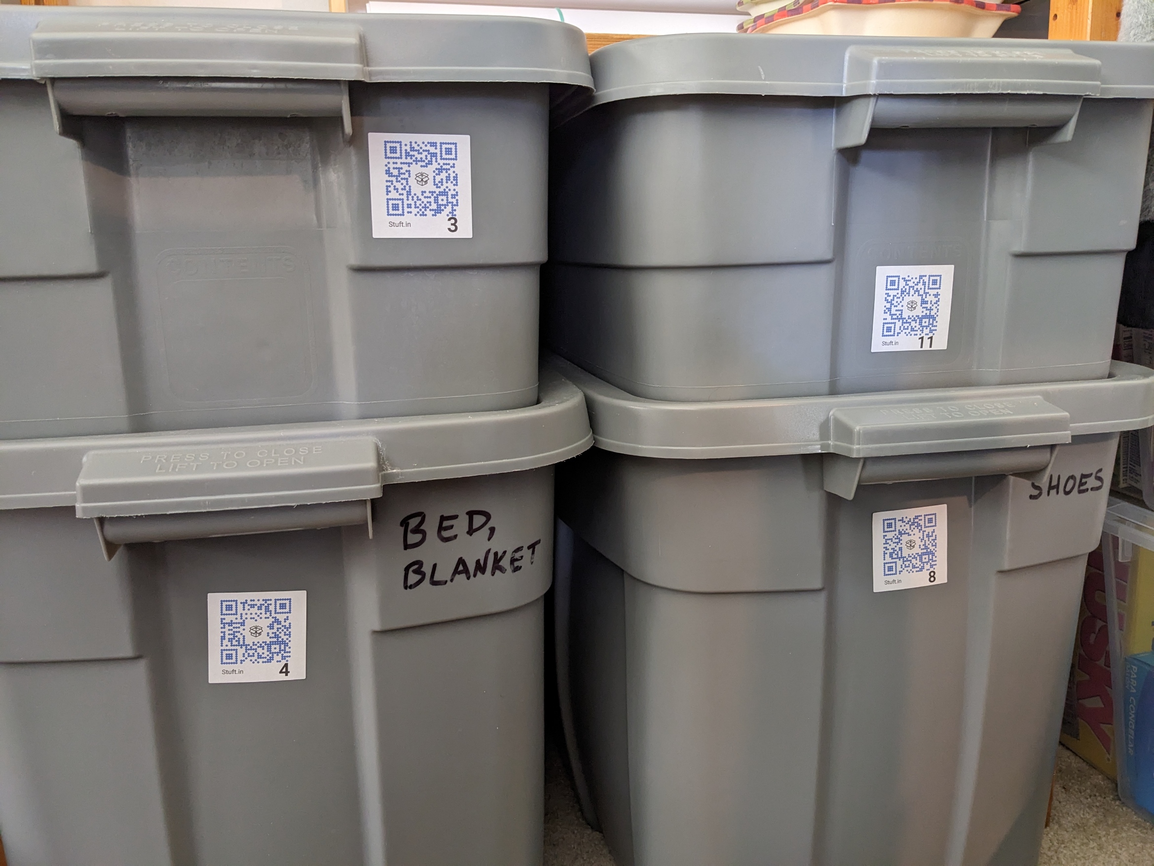 Shelf of labeled bins